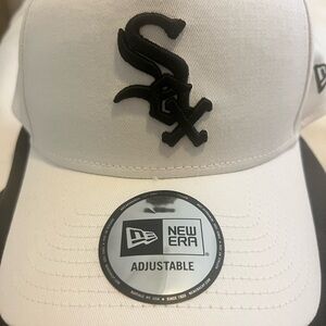 *Never worn* Chicago White Sox Hat. Adjustable fit. White with Black Logo.